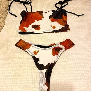 Cow print thing bikini never worn size large